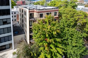 Portland apartment for rent - an aerial view of an apartment building with trees
