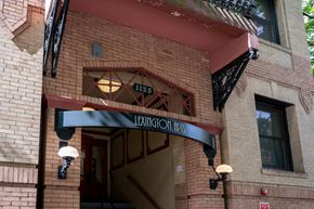 Portland apartment for rent - the front of a brick building with an entrance sign
