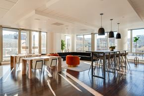 Portland apartment for rent - A modern dining room with a long table and chairs.