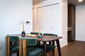 Portland apartment for rent - a dining room with a wooden table and green chairs at Slabtown Square Apartments, Oregon, 97209