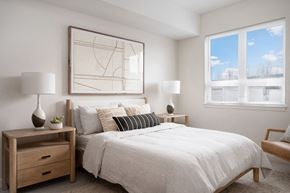 Milwaukie apartment for rent - a bedroom with a large bed and two windows