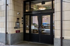 Portland apartment for rent - the entrance to a building with a black revolving door