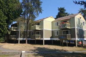 Renton apartment for rent - A row of houses with balconies and flower pots.