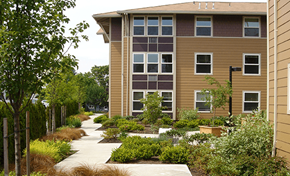 Portland apartment for rent - an apartment building with a garden in front of it