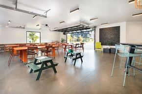Portland apartment for rent - a room with tables and chairs and a chalkboard on the wall