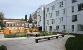 Portland apartment for rent - a courtyard with a picnic table in front of an apartment building