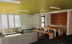 Portland apartment for rent - a room with couches a table and chairs and a kitchen