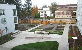 Portland apartment for rent - a community garden with benches and a wooden fence