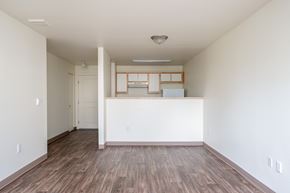 Gresham apartment for rent - A room with wooden floors and white walls.