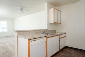Hillsboro apartment for rent - A kitchen with a washer and dryer built in.