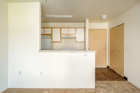 Hillsboro apartment for rent - A kitchen area with a white counter and wooden cabinets.
