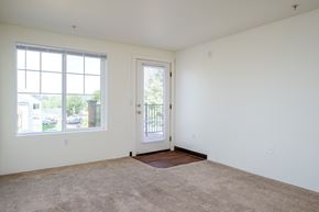 Portland apartment for rent - A room with a door, window and carpet.