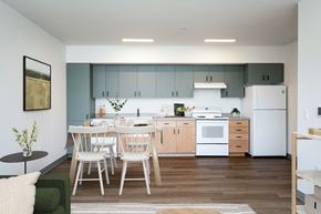 Salem apartment for rent - a kitchen with white appliances and a table and chairs