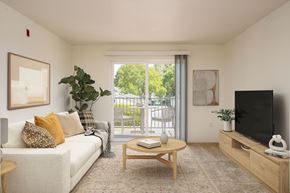 Hillsboro apartment for rent - A living room with a couch, coffee table, and television.