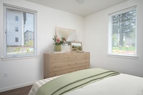 Oregon City apartment for rent - a bedroom with a bed and two windows