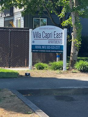 Beaverton apartment for rent - a sign for villa capri east apartments in front of a fence