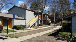 Rogue River apartment for rent - a sidewalk in front of a row of houses