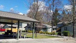 Rogue River apartment for rent - a patio with a table and chairs in front of houses
