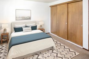 Mcminnville apartment for rent - a bedroom with a bed and a wardrobe