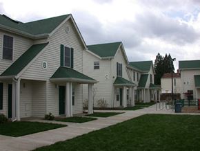 Canby apartment for rent - a row of white homes with green roofs