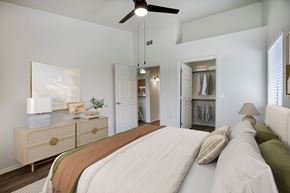 Casa Grande apartment for rent - A bedroom with a large bed and a ceiling fan.