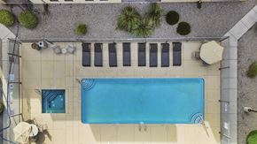 Albuquerque apartment for rent - A rectangular pool with a blue tiled border and a white tiled floor.
