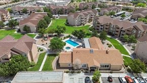 Albuquerque apartment for rent - A large apartment complex with a pool in the middle.