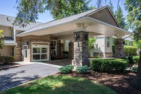 Marysville apartment for rent - A house with a covered entrance and a stone pillar.