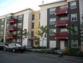 Portland apartment for rent - an image of an apartment building with cars parked in front
