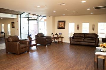 Coolidge apartment for rent - a living room with leather couches and chairs