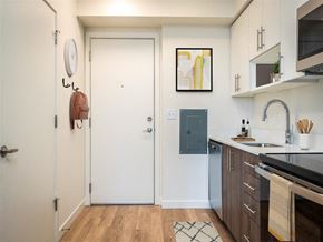 Portland apartment for rent - a small kitchen with a sink and a door to the bathroom