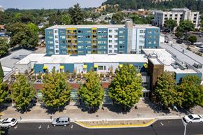 Eugene apartment for rent - an aerial view of a building with trees in front of it
