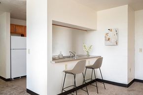 Eugene apartment for rent - a small kitchen with a counter and two stools