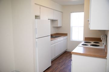 Buckeye apartment for rent - a kitchen with white cabinets and a white refrigerator