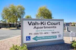 Coolidge apartment for rent - A sign for Vah-Ki Court Apartments is displayed in front of a building.