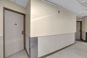 Memphis apartment for rent - the hallway of a building with a door and a white wall