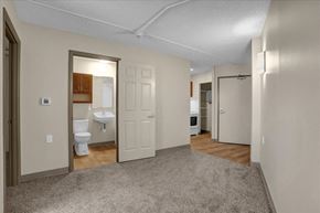 Memphis apartment for rent - a living room with a door to a bathroom and a toilet