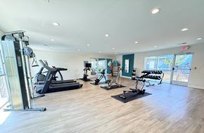 Huntsville apartment for rent - A gym with treadmills, elliptical machines, and other exercise equipment.