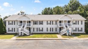 Bessemer apartment for rent - A white two-story house with a porch and a driveway in front.