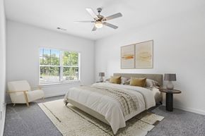 Augusta apartment for rent - a bedroom with a bed and a ceiling fan
