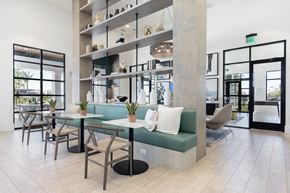 Orlando apartment for rent - tables, chairs, and bench seating in clubhouse at Lake Nona Concorde