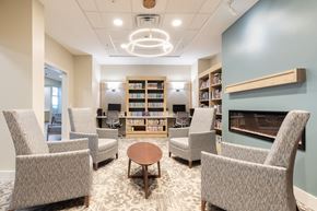 Winter Haven apartment for rent - A room with a fireplace and bookshelves.