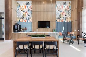 Orlando apartment for rent - A modern dining room with a wooden table and chairs.