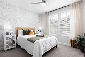 Orlando apartment for rent - a bedroom with a bed and a large window
