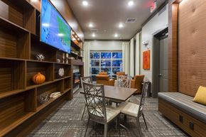 Orlando apartment for rent - Lounge with tables chairs and tv  at LandonHouse in Lake Nona