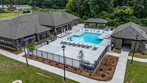 Augusta apartment for rent - an aerial view of a resort style pool with lounge chairs