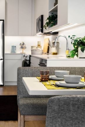 Jersey City apartment for rent - a kitchen with a table with plates and cups on it
