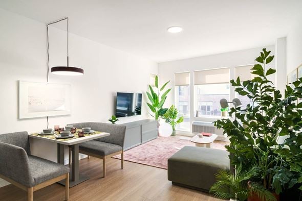 Jersey City apartment for rent - a rendering of a living room with a table and chairs