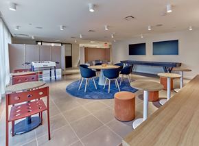 Jersey City apartment for rent - a common room with tables and chairs and a pool table