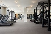 Jersey City apartment for rent - a gym with cardio equipment and weights on the floor